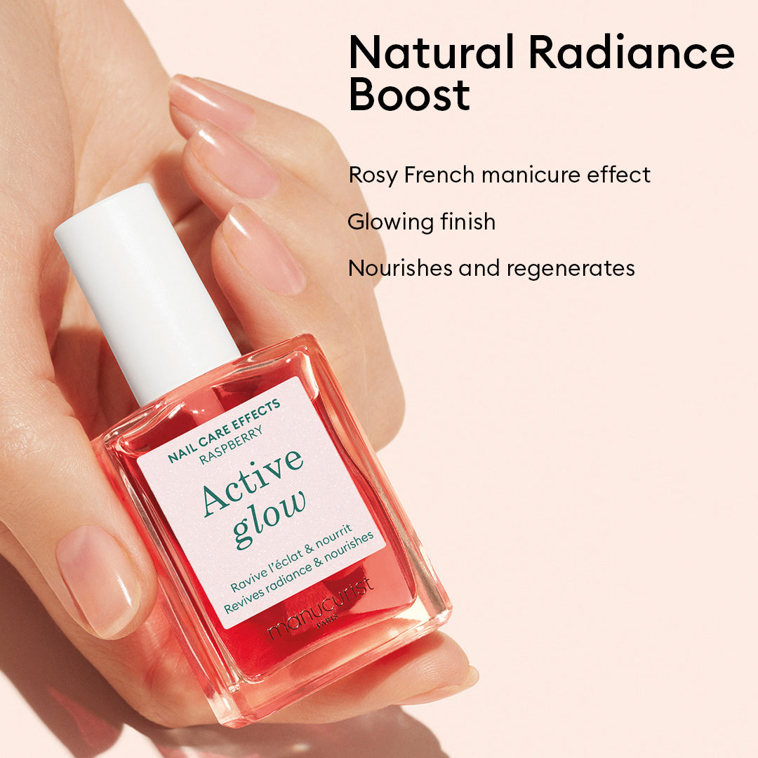 A hand holds a pink bottle of Manucurist Healthy Glow Duo. Text reads: Natural Radiance Boost. Rosy French manicure effect with a glowing finish. Nourishes and regenerates nails for ultimate care.