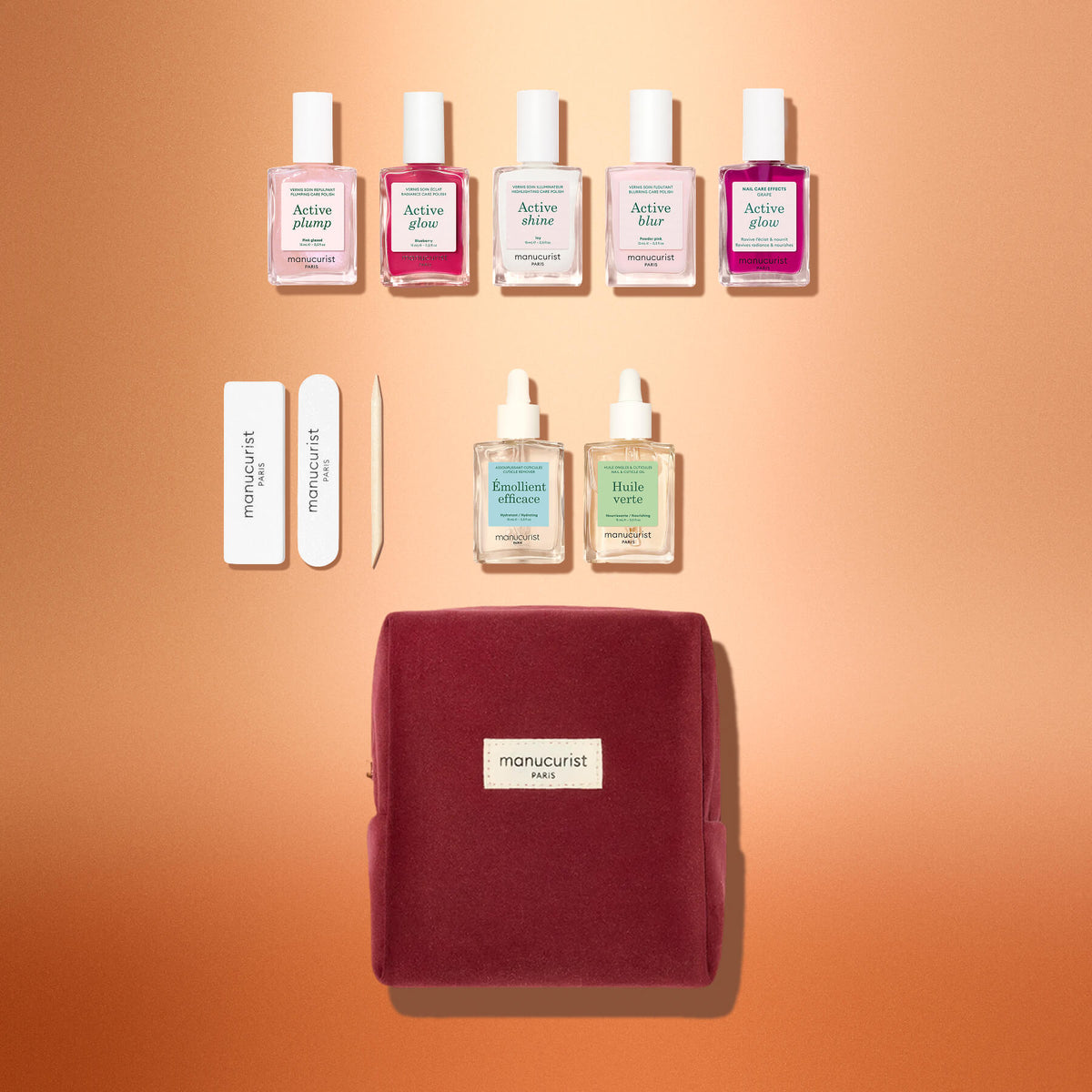 The Manucurist Active™ Starter Kit Gift Set includes five bottles of nail polish, a nail file, a cuticle pusher, two bottles of nail treatment, and a velvet pouch, perfect as a holiday gift.