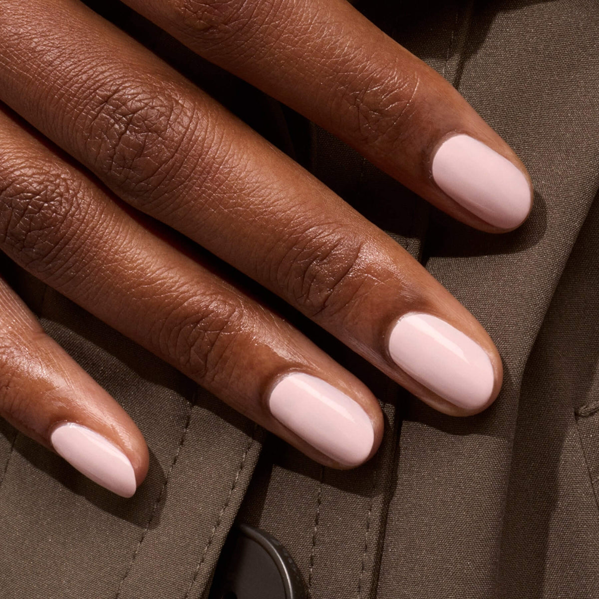 A close-up of a hand with neatly manicured nails painted with Manucurist&