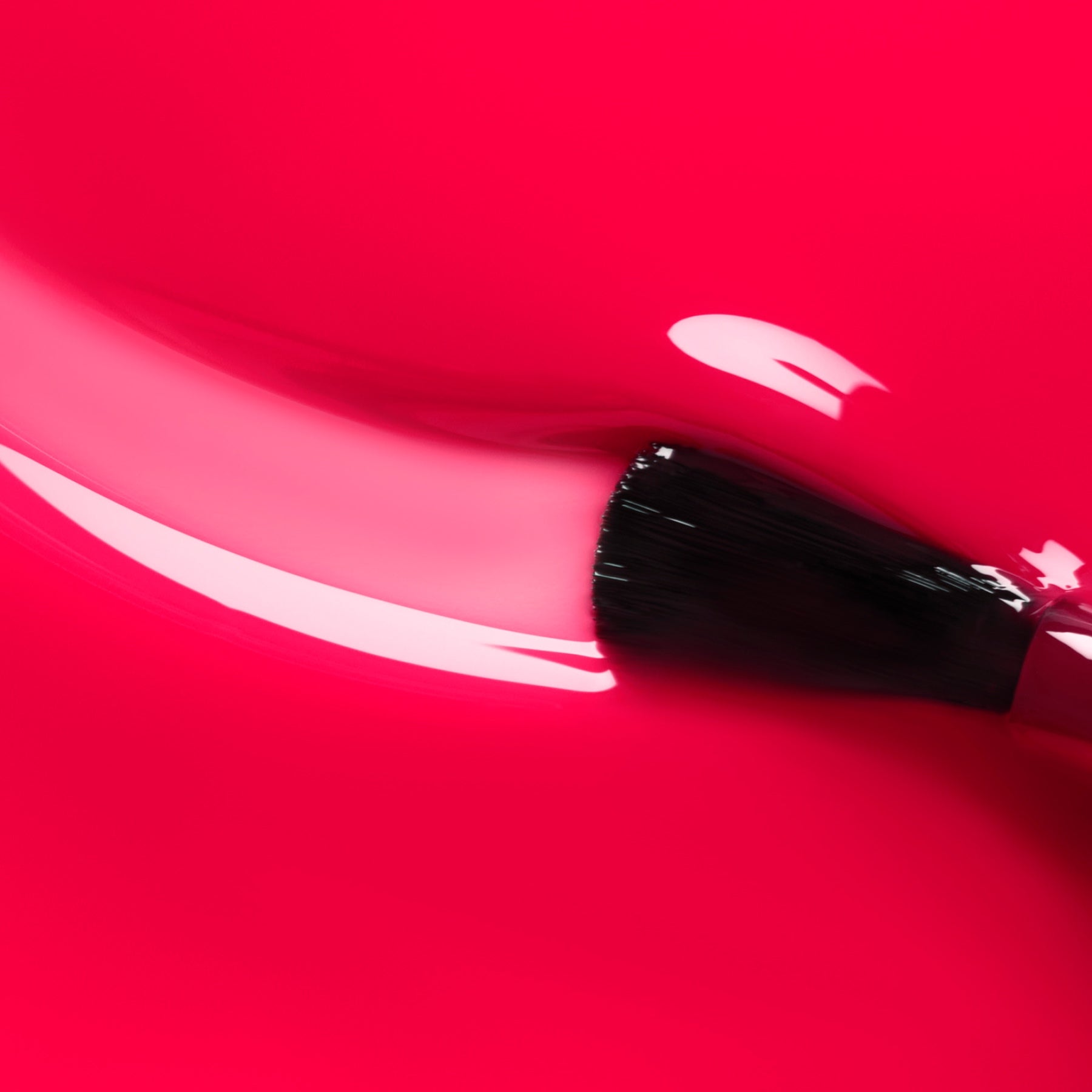 A close-up of a makeup brush gliding Manucurist&