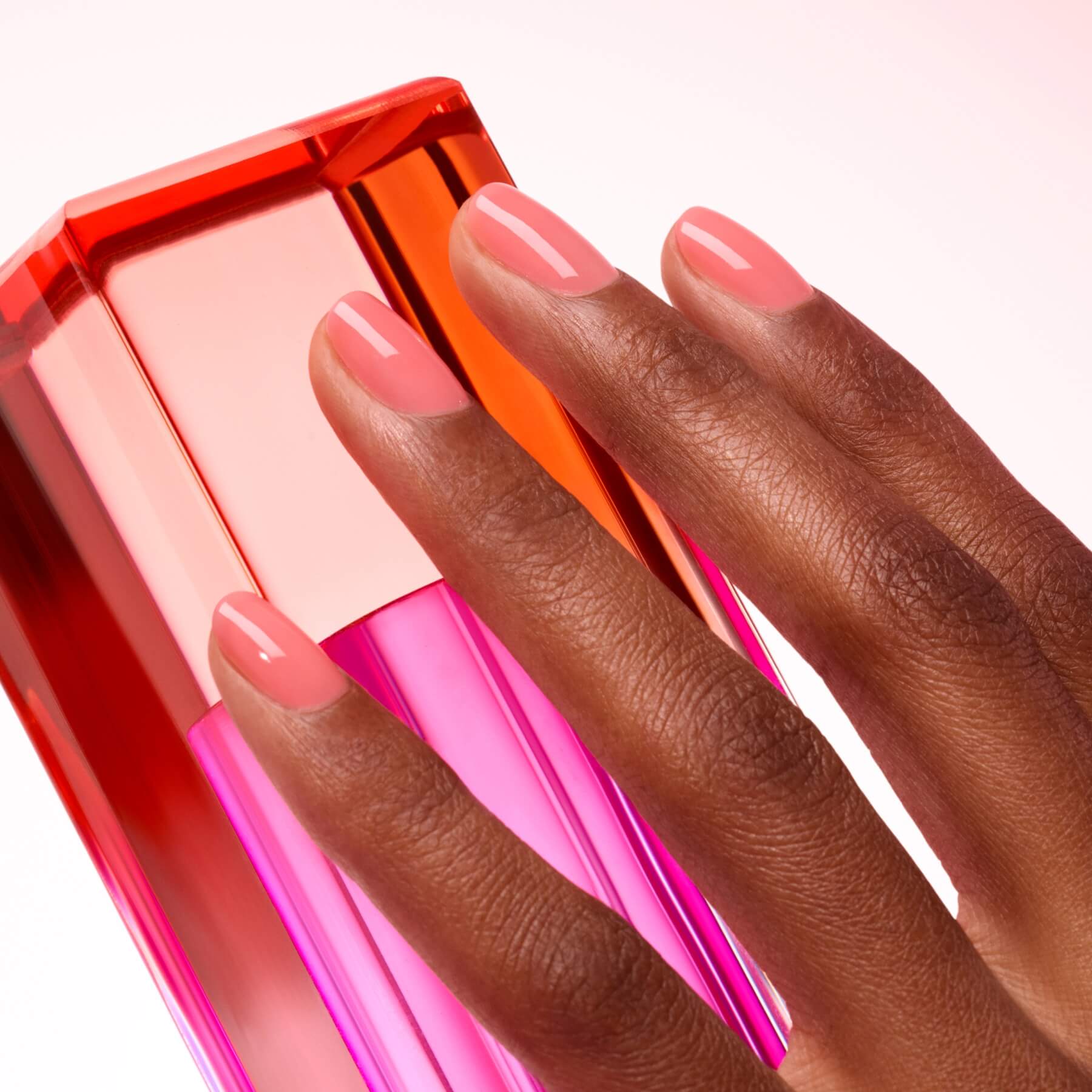 A hand with medium-dark skin tone wears Manucurist&