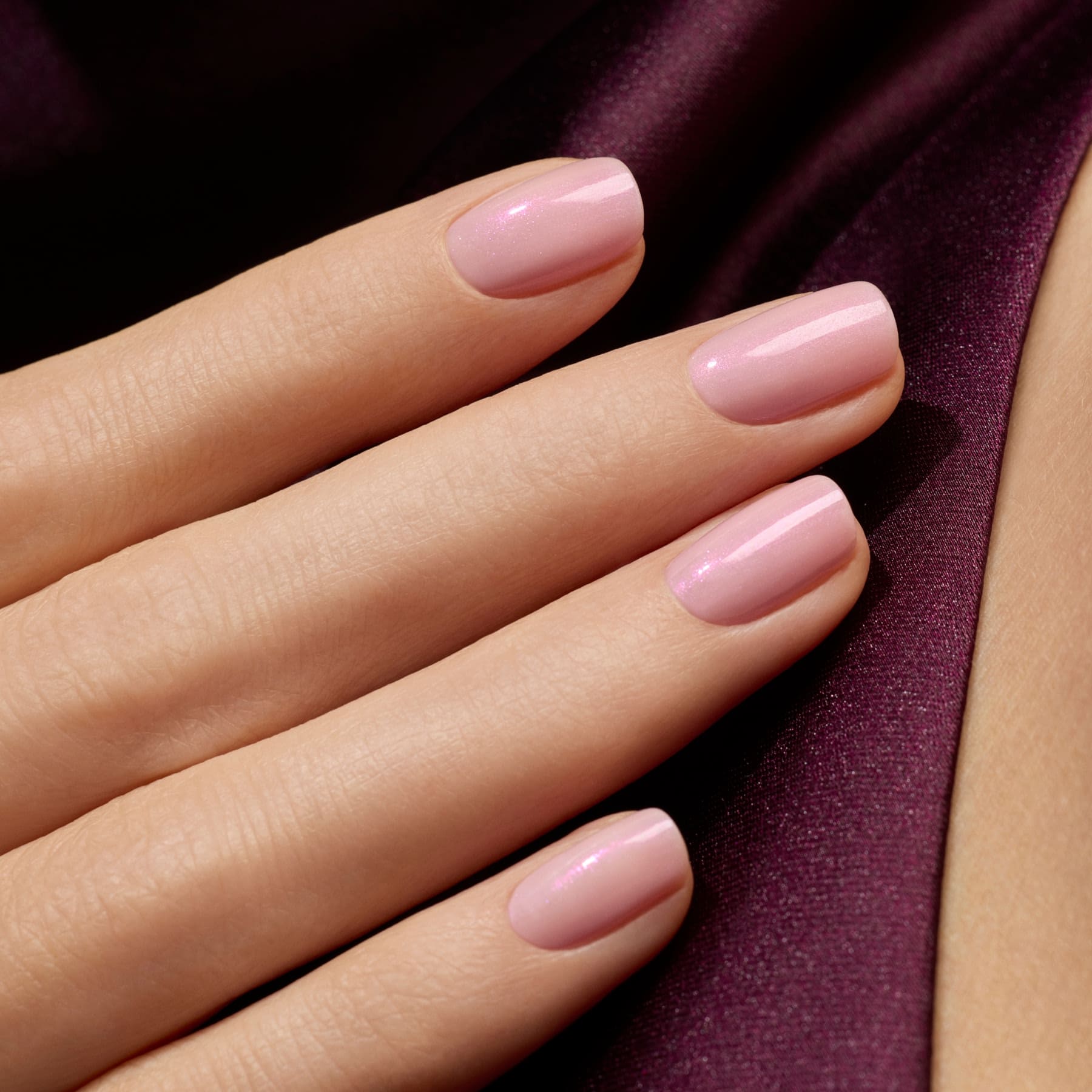 A close-up of a hand with neatly manicured nails painted in Manucurist&