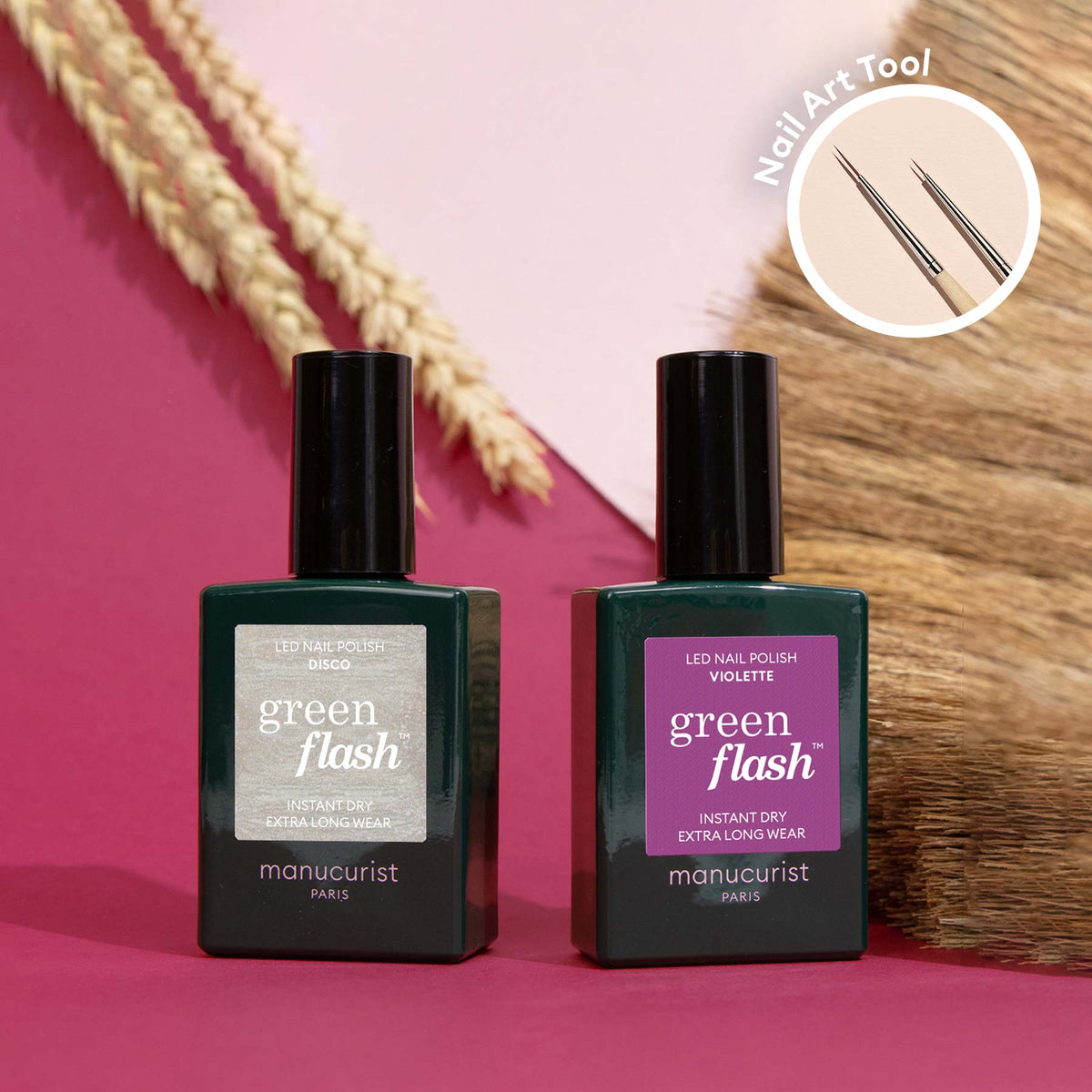 Two bottles of Manucurist Shiny Summer sit on a pink surface with dried grass in the background. A circular inset highlights a Nail Art Brush, ideal for creating Shiny Summer nail art looks.