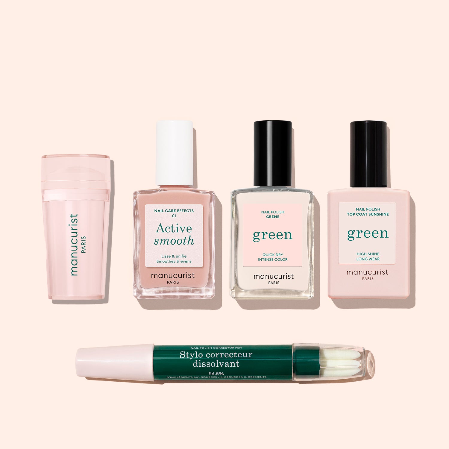 The Manucurist French Active™ Kit, featuring “Active Smooth,” “Green,” “Green Top Coat Sunshine” polishes, a Mani stamper, and a green-capped Stylo correcteur dissolvant pen, is displayed on a light beige background.