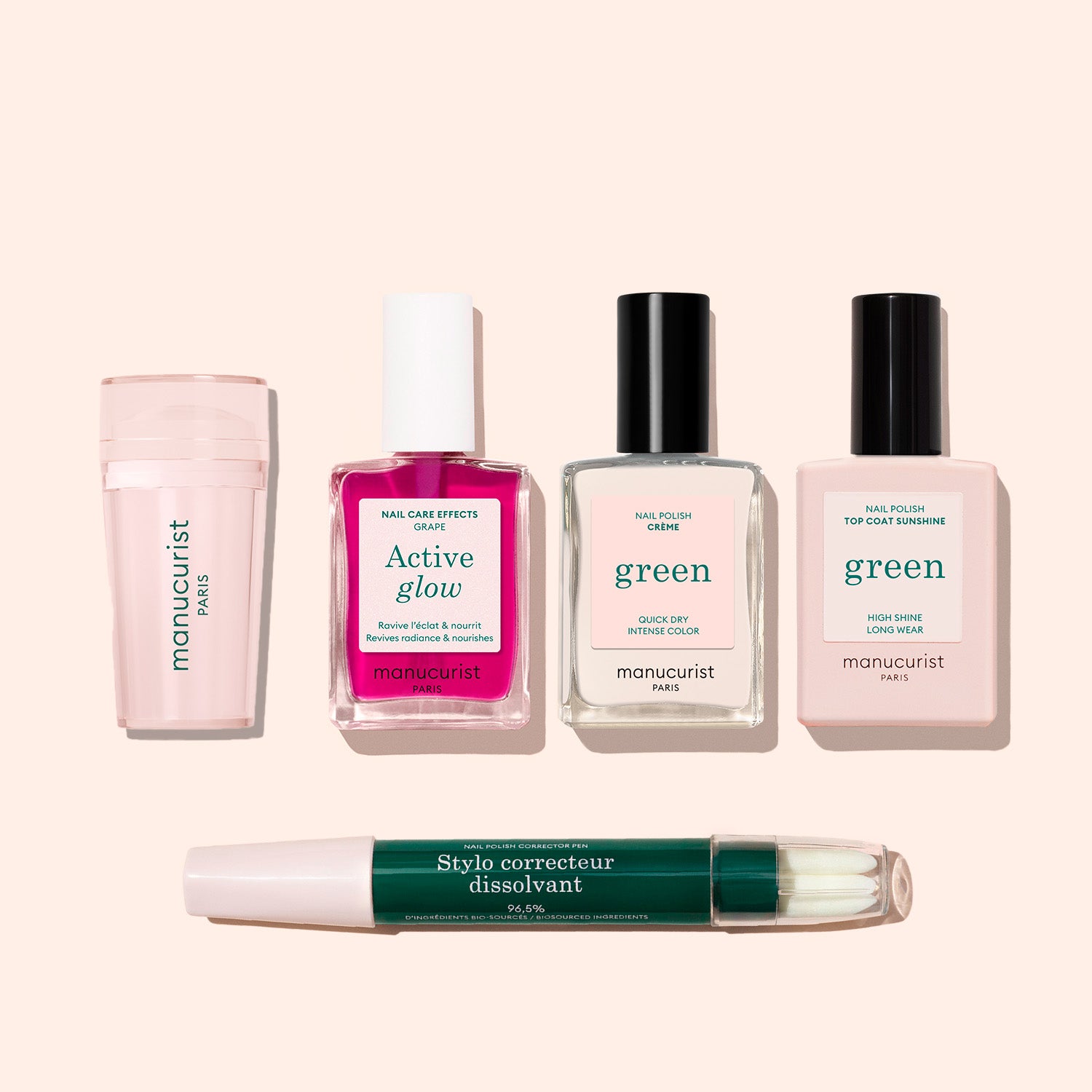 Five manicure essentials from the French Active™ Kit are arranged on a light beige background: a pale pink nail polish remover, bright pink nail care effects bottle, clear nail polish, pale pink nail polish, and a green correction pen.