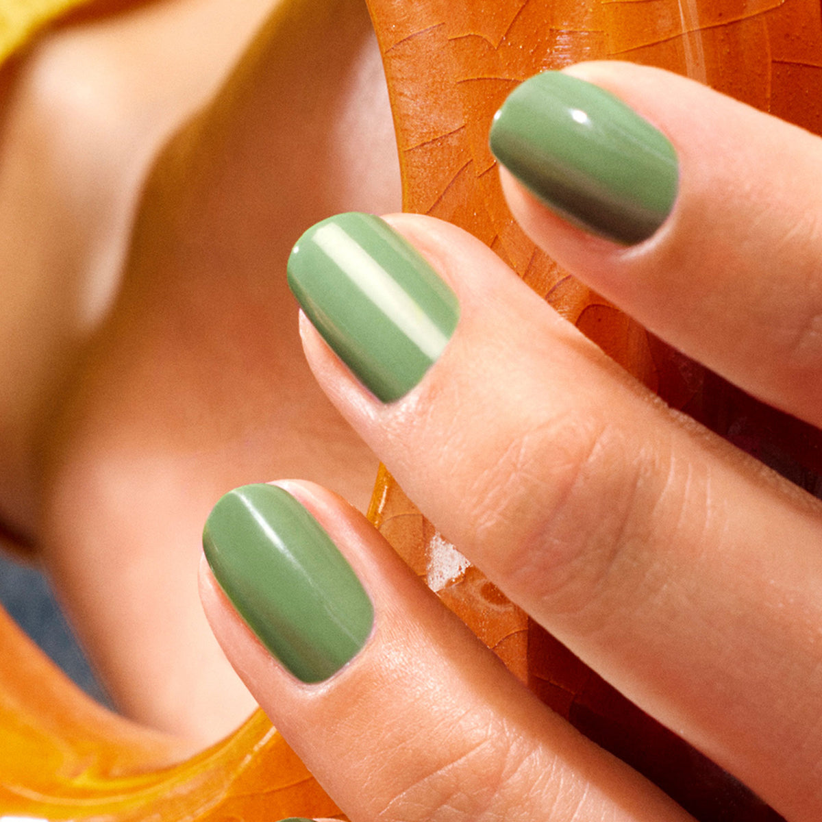 A close-up of a hand with neatly manicured nails painted in Manucurist&