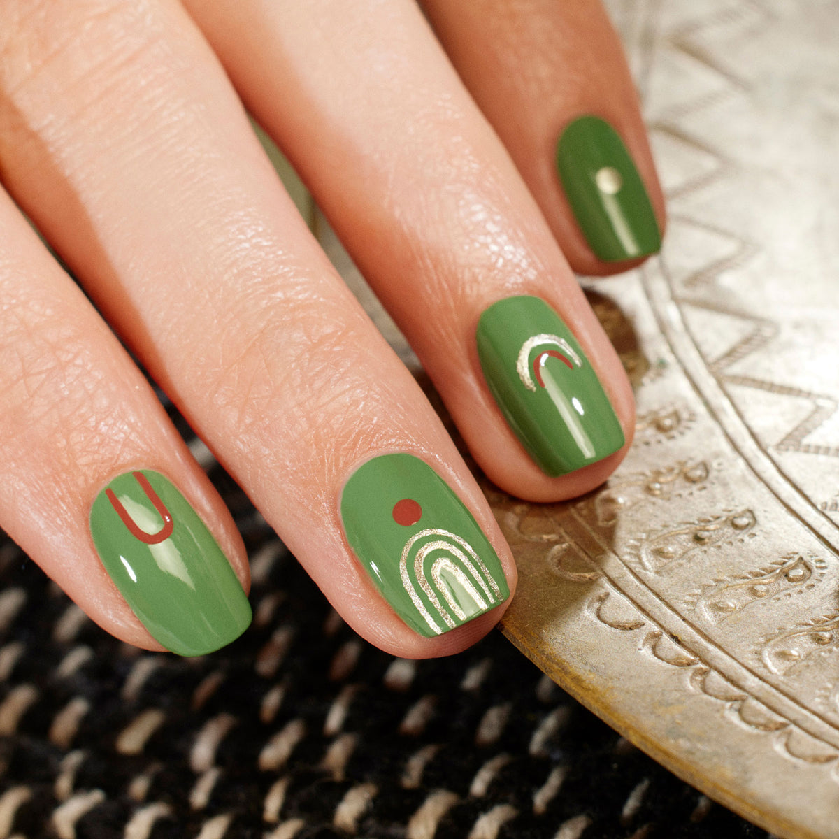 Short, almond-shaped nails painted in Manucurist&