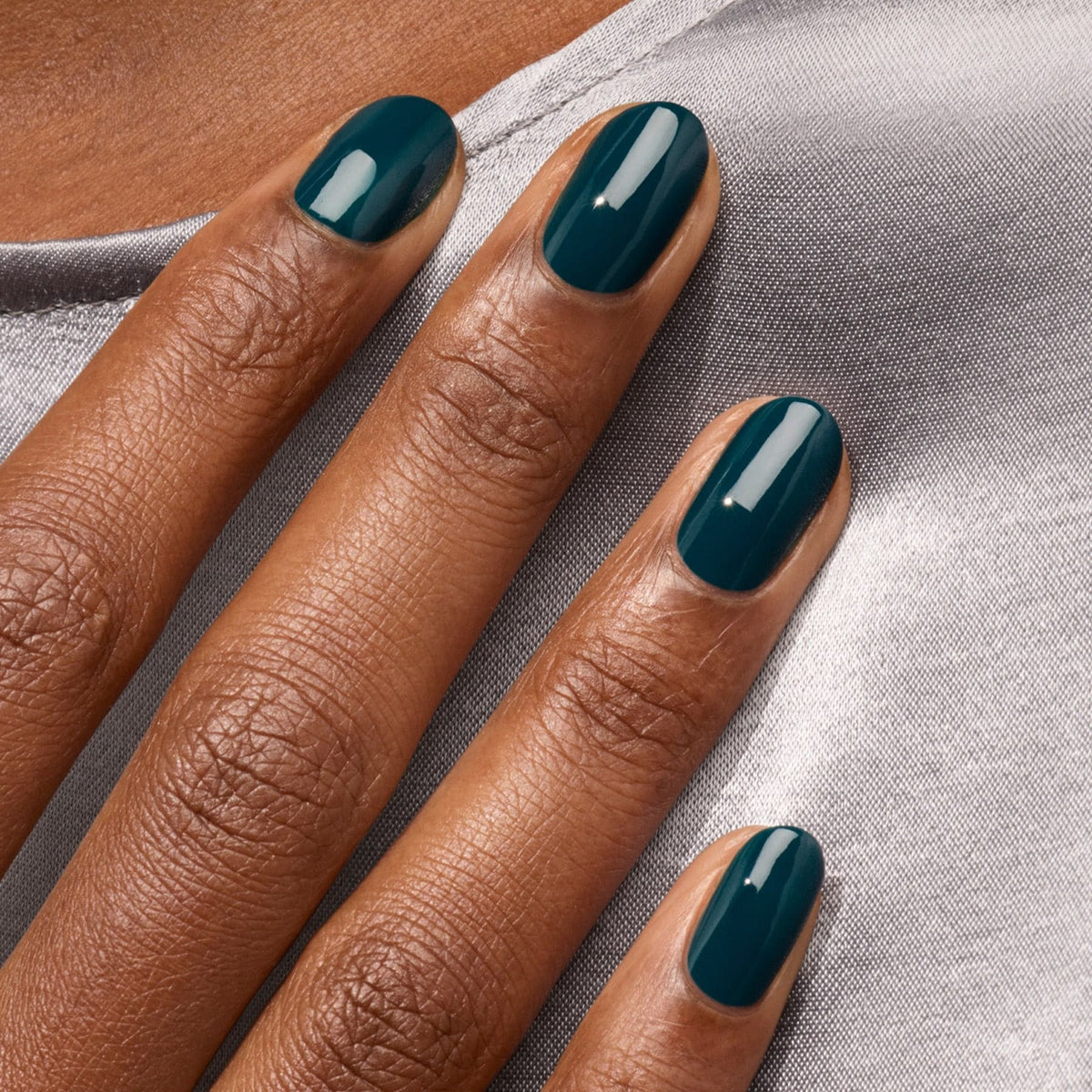 A close-up of a hand with neatly manicured nails painted in Manucurist&