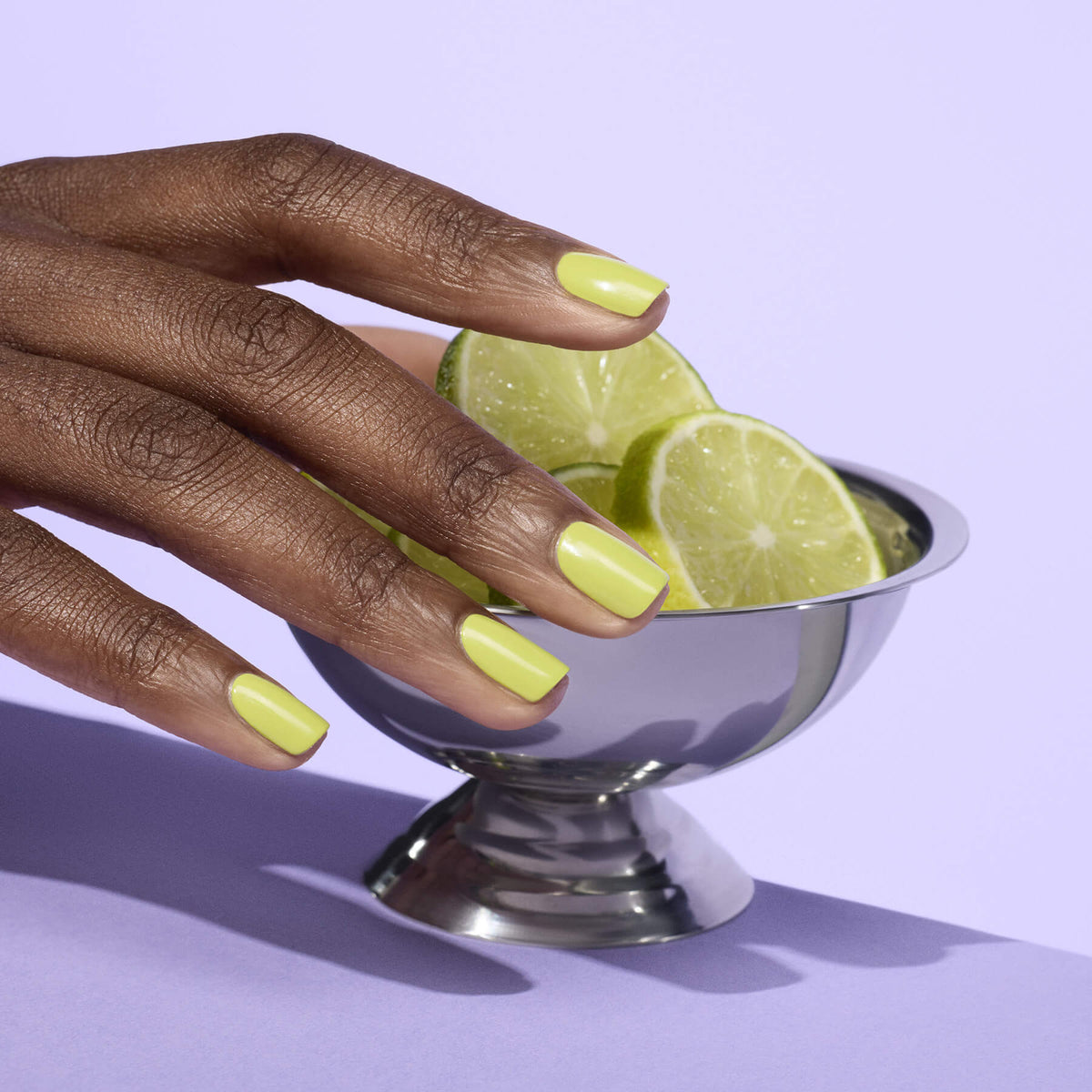 A hand with neatly manicured nails in Manucurist&