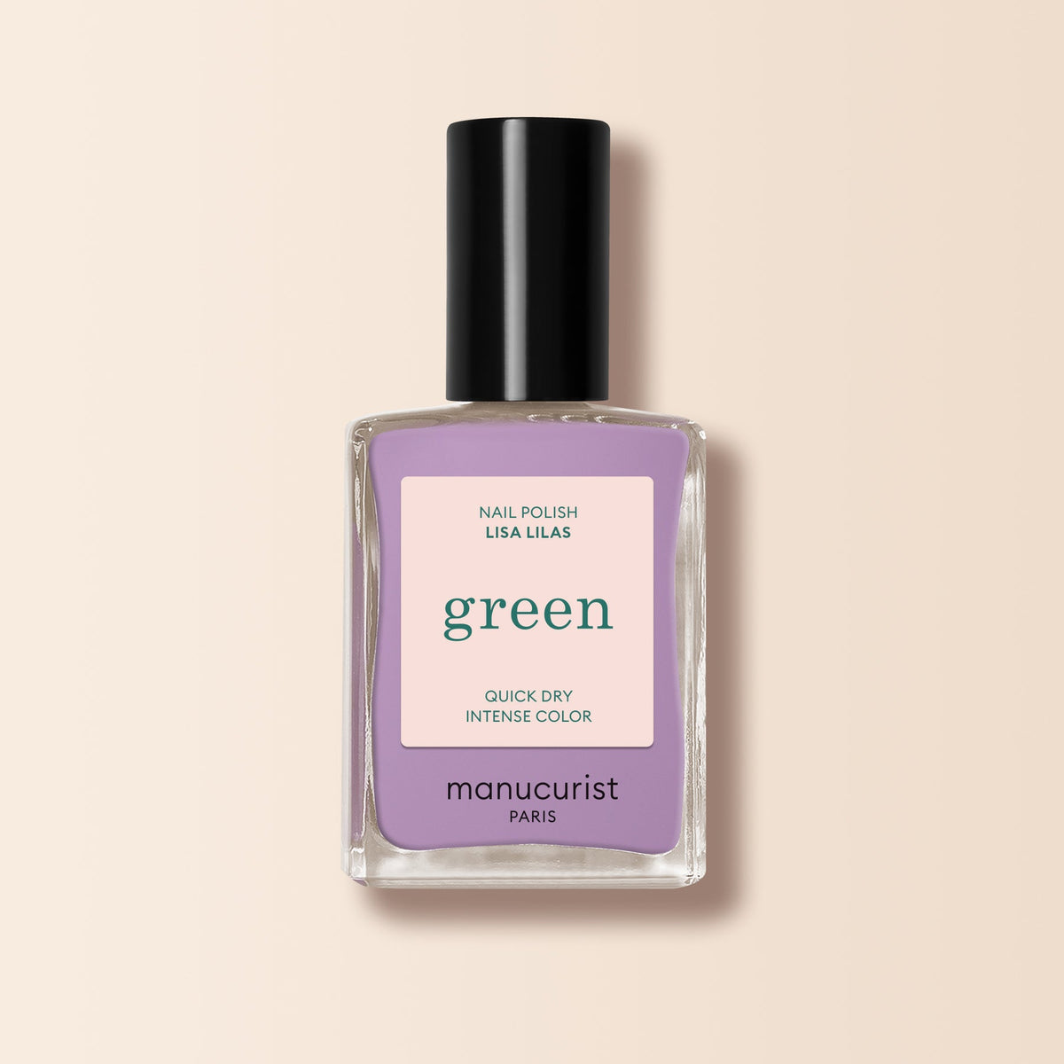 A bottle of Manucurist Lisa Lilas nail polish sits on a pale beige background, its black cap and minimalist beige label evoking 90s style.