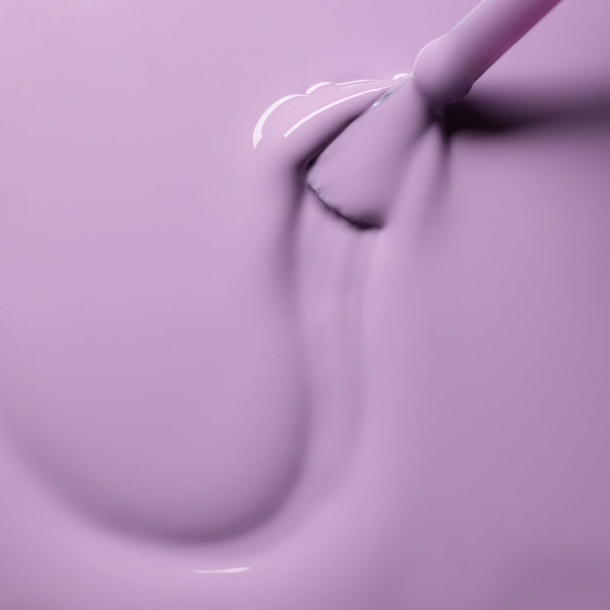 A close-up of a brush applying Manucurist&