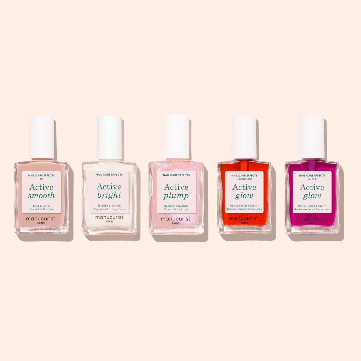 Five bottles of Manucurist Active™ plant-based nail care polish, each labeled with a different effect—Active™ Smooth 01, Active™ Bright, Active™ Plump, and two shades of Active™ Glow—are lined up on a light beige background. This CC Polish Treatment collection is carefully formulated to enhance the beauty of your nails while providing gentle care.
