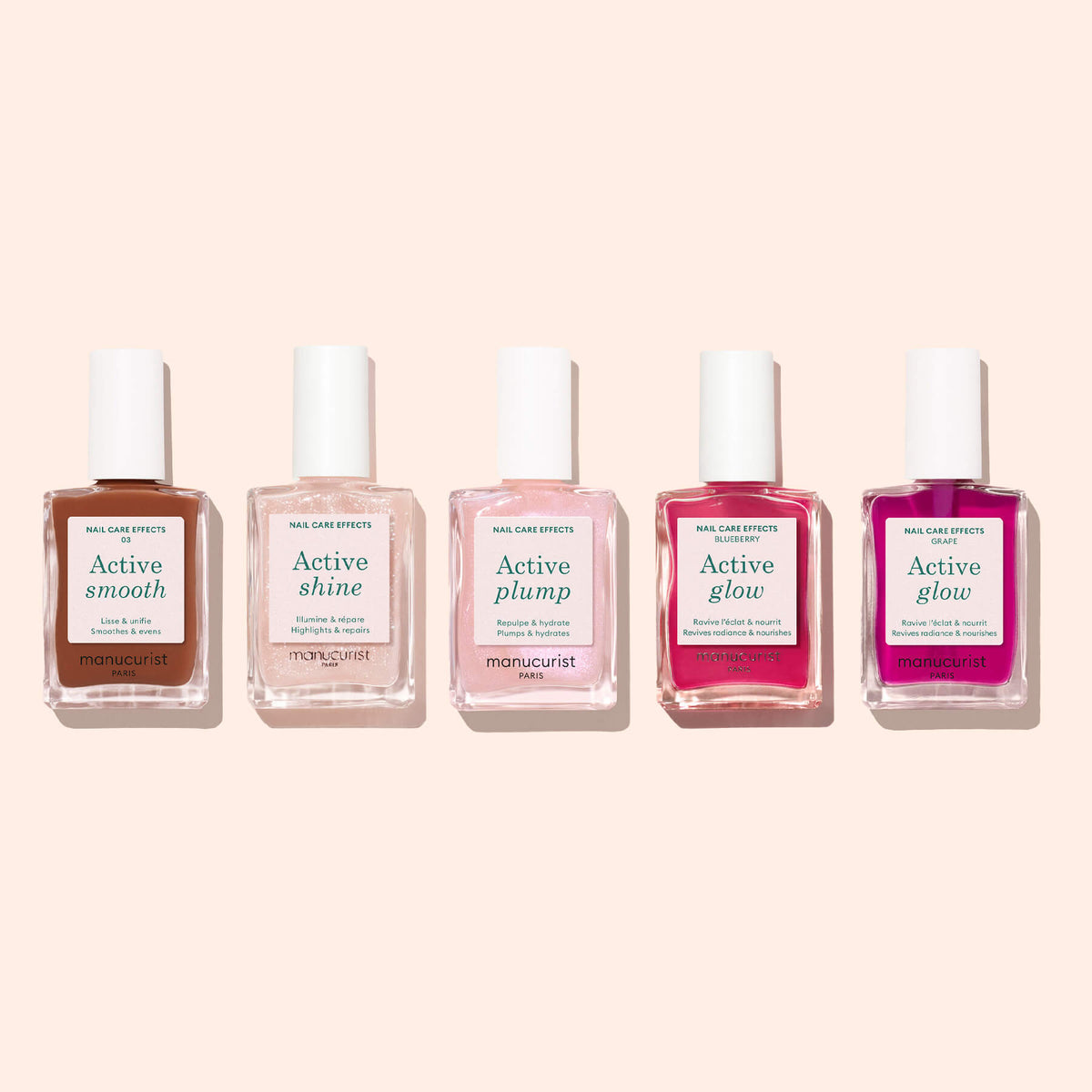 Sure! Here’s the rewritten sentence using your provided product data: Five bottles of Manucurist Active™ Smooth 03 Nail Care polish in a range of shades—including Active Smooth, Active Shine, Active Plump, and two variations of Active Glow (light pink and bright pink)—are arranged on a light beige background. Each bottle highlights advanced nail care by Manucurist, delivering results comparable to the nourishing benefits of a CC Polish Treatment.