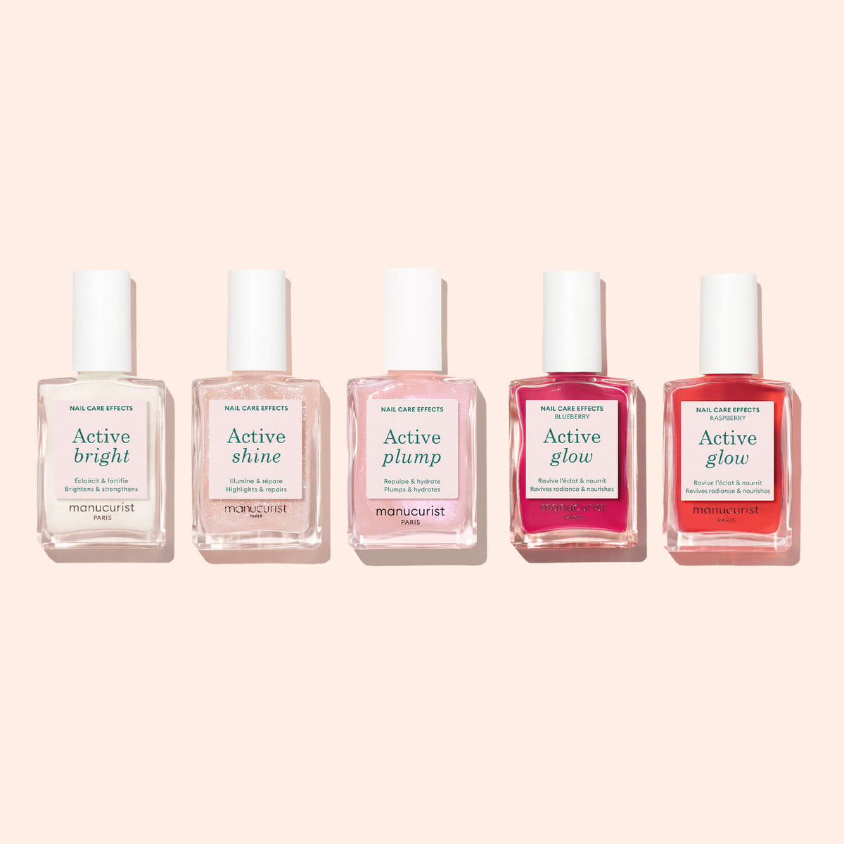 Five bottles of Manucurist nail care products—including the bio-based Active™ Bright nail polish in clear, pale pink, and red shades—are lined up against a light pink background. Each bottle features a different effect: Active™ Bright, Shine, Plump, and two Glow varieties, providing benefits ranging from nail strengthening to vibrant color.