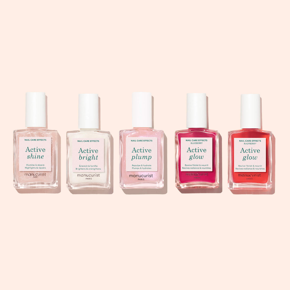 Five bottles of Manucurist’s Active™ Shine Opal plant-based nail care polish are lined up on a pale pink background, each labeled with different effects: Active shine, Active bright, Active plump, Active glow, and Active glow (coral). These nourishing formulas from Manucurist act as both a nail care treatment and a gentle nail strengthener.