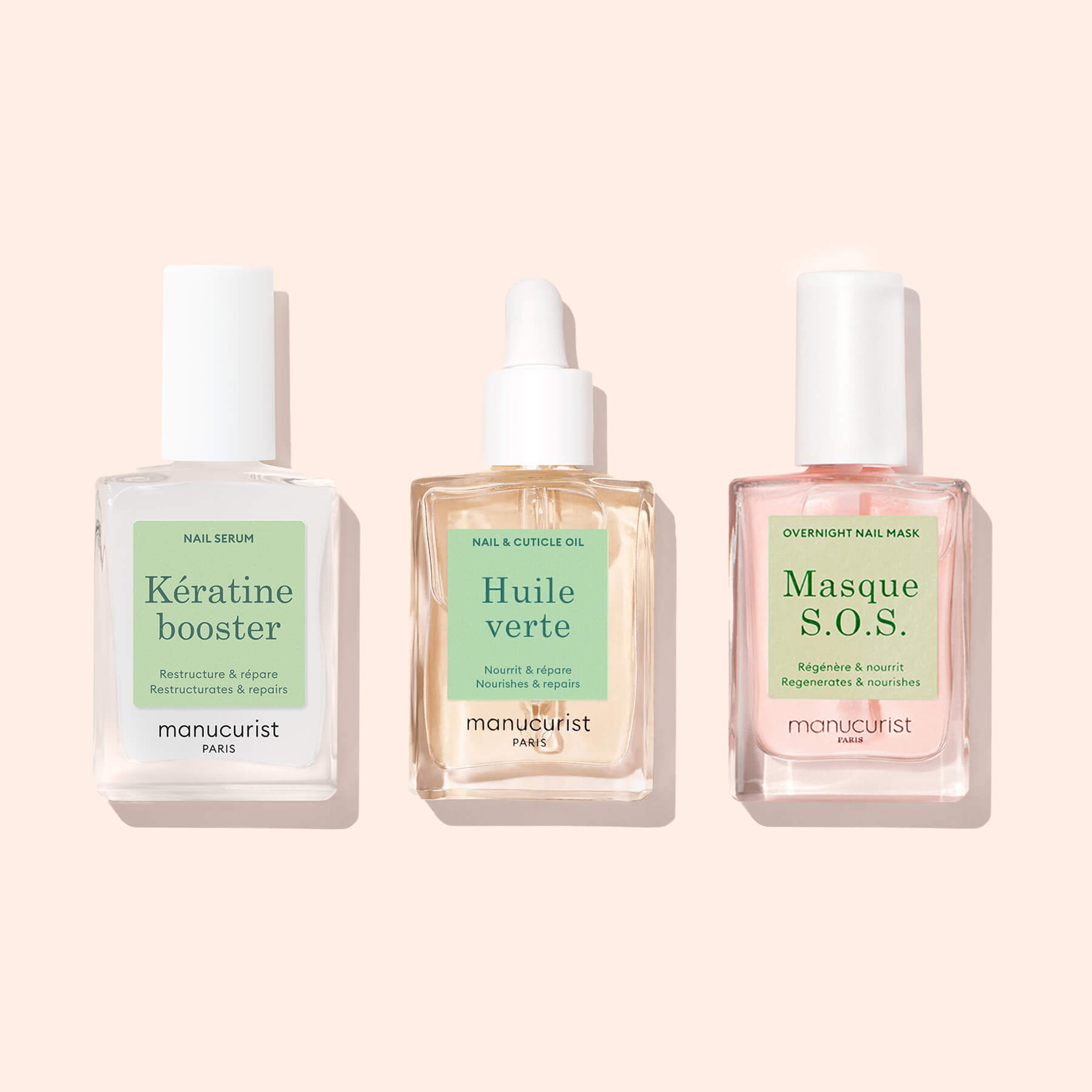 Three Manucurist Basic Routine – Damaged Nails products—nail strengthener, cuticle oil, and mask—stand side by side with pastel labels on a pale background.