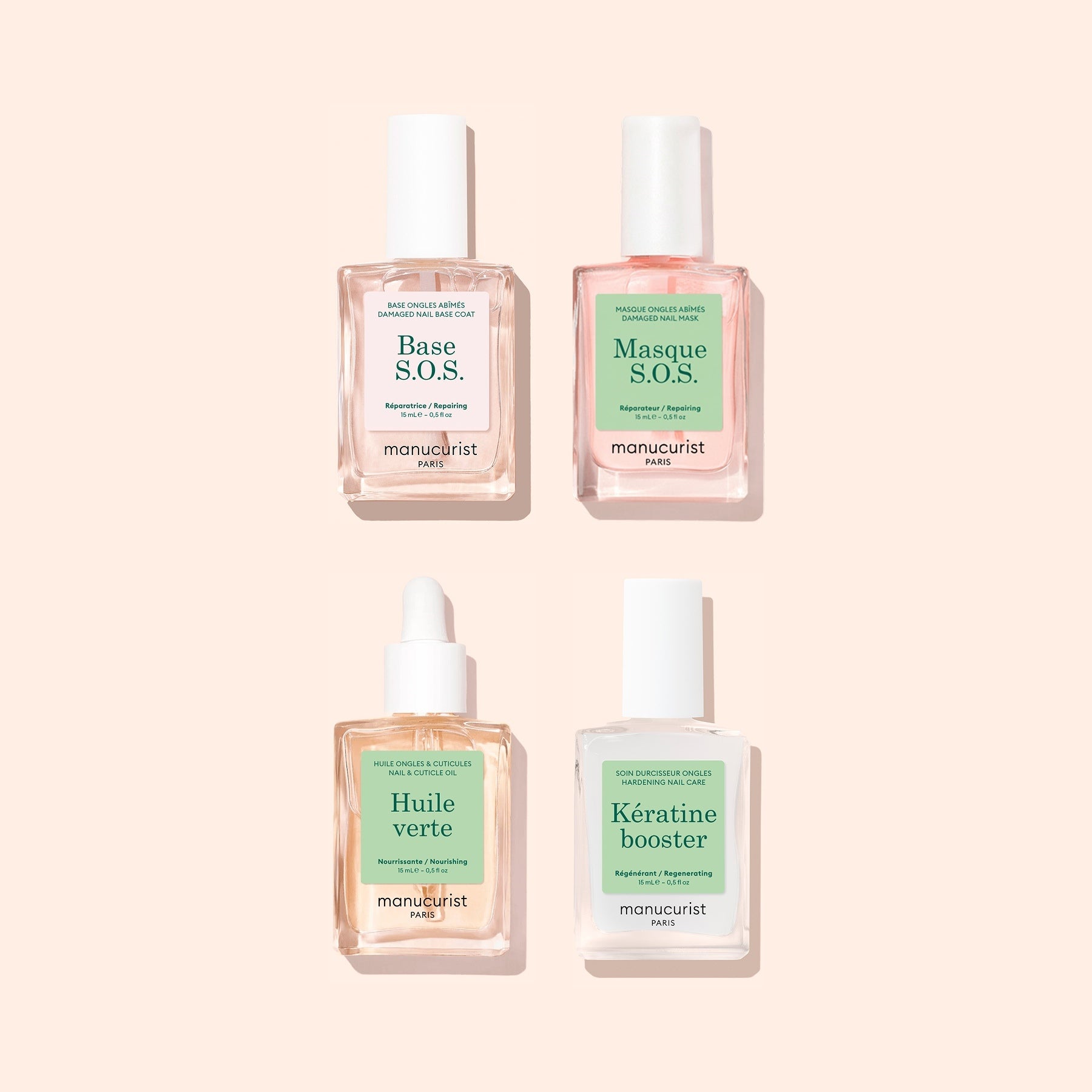 A set of four square bottles from Manucurist’s Basic Routine - Damaged Nails collection, displayed on a light pink background and labeled Base S.O.S., Masque S.O.S., Huile Verte, and Kératine Booster—each expertly formulated to strengthen brittle nails and repair damage for healthier-looking hands.