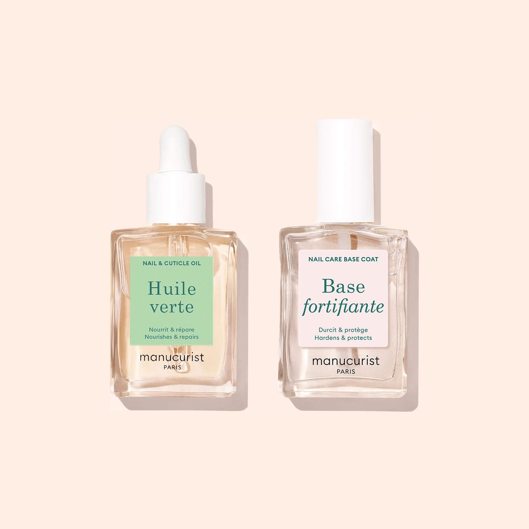 Two clear glass bottles of Manucurist&