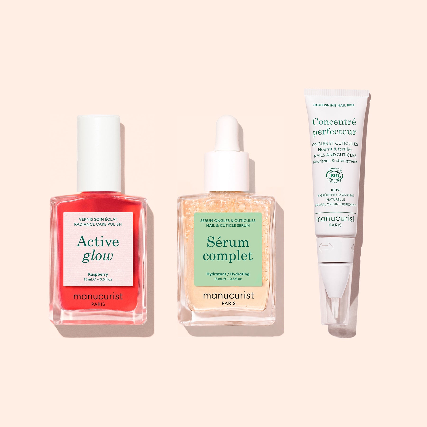 The Starter Routine - Sensitive Nails from Manucurist is displayed on a pale background, featuring three essentials: a pink Active Glow nail polish for strengthening, a Sérum Complet cuticle serum in a dropper bottle, and a white tube of Concentré Perfecteur—a complete nail care set by Manucurist.