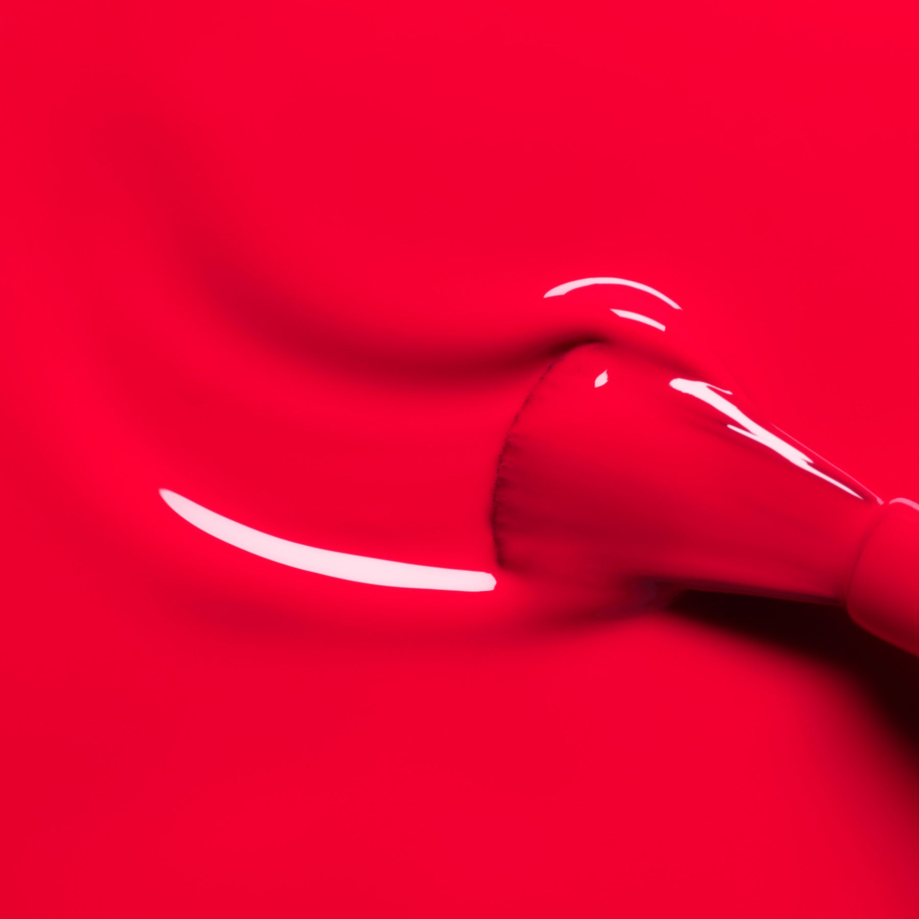 A makeup brush glides Manucurist&