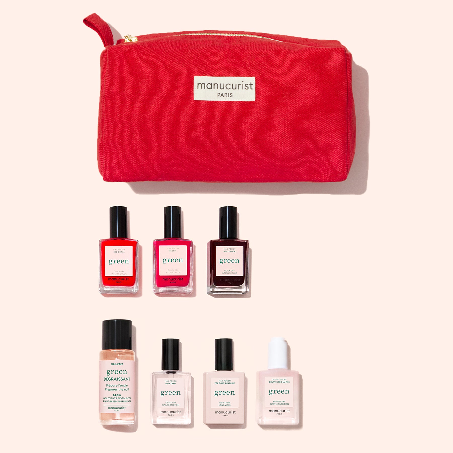 The Manucurist Starter Kit features a red pouch and seven nail care products, including plant-based polish and Green manicure essentials for a gel effect without a lamp, all neatly arranged on a light background.