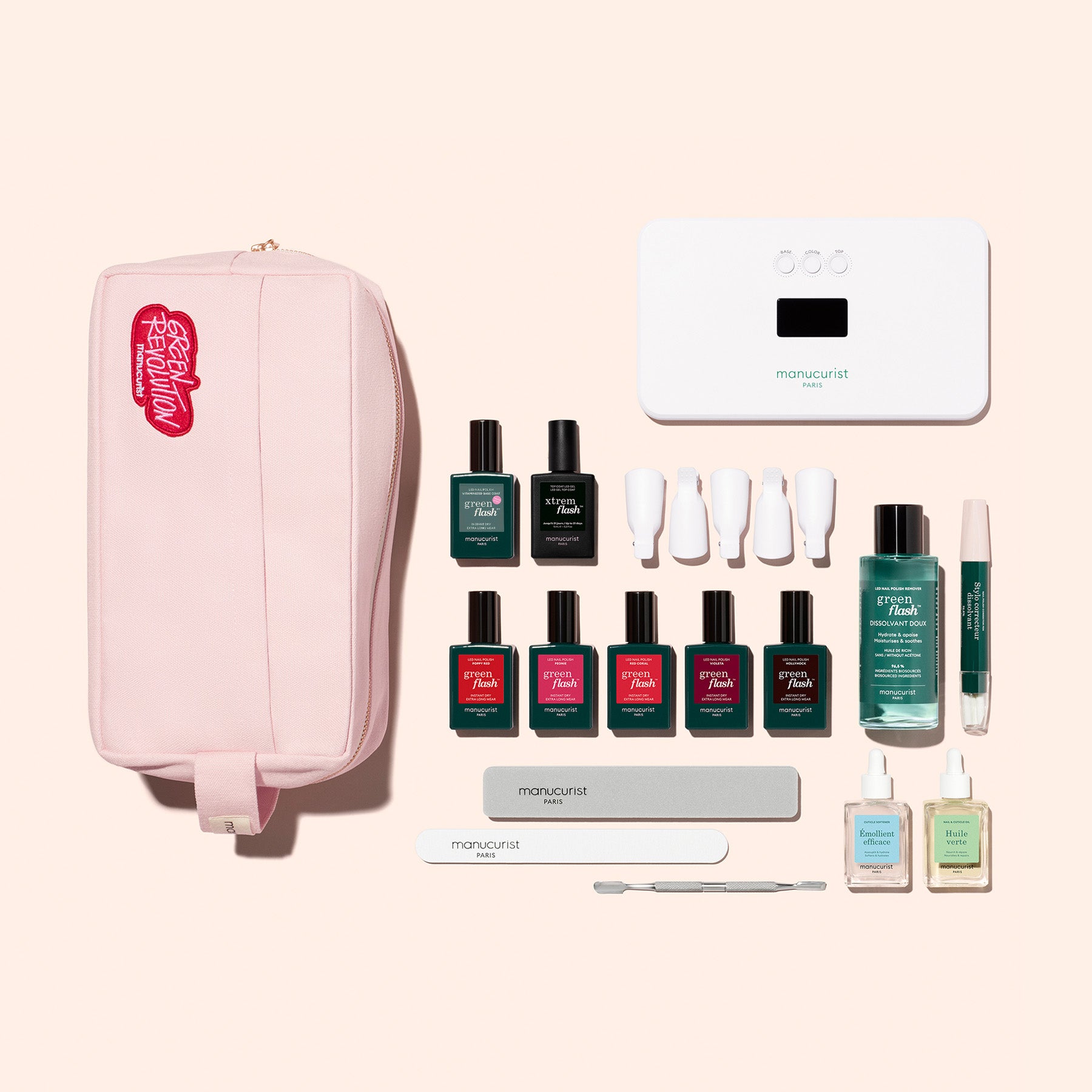 The Super Addict Kit by Manucurist includes a pink travel pouch, gel polish in assorted colors, nail files, cuticle tools, remover, a vitaminized base coat, top coat, and more—perfect for glossy manicures anywhere.