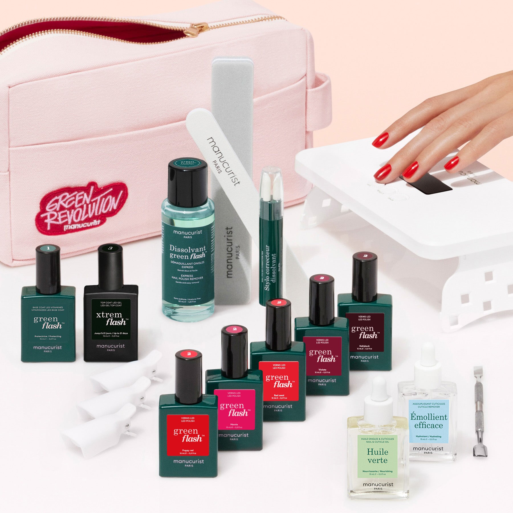 The Manucurist Super Addict Kit includes Green Flash gel polish, a vitaminized base coat, nail care tools, a UV lamp, and a pink pouch—everything you need for an ultra-glossy red manicure at home.