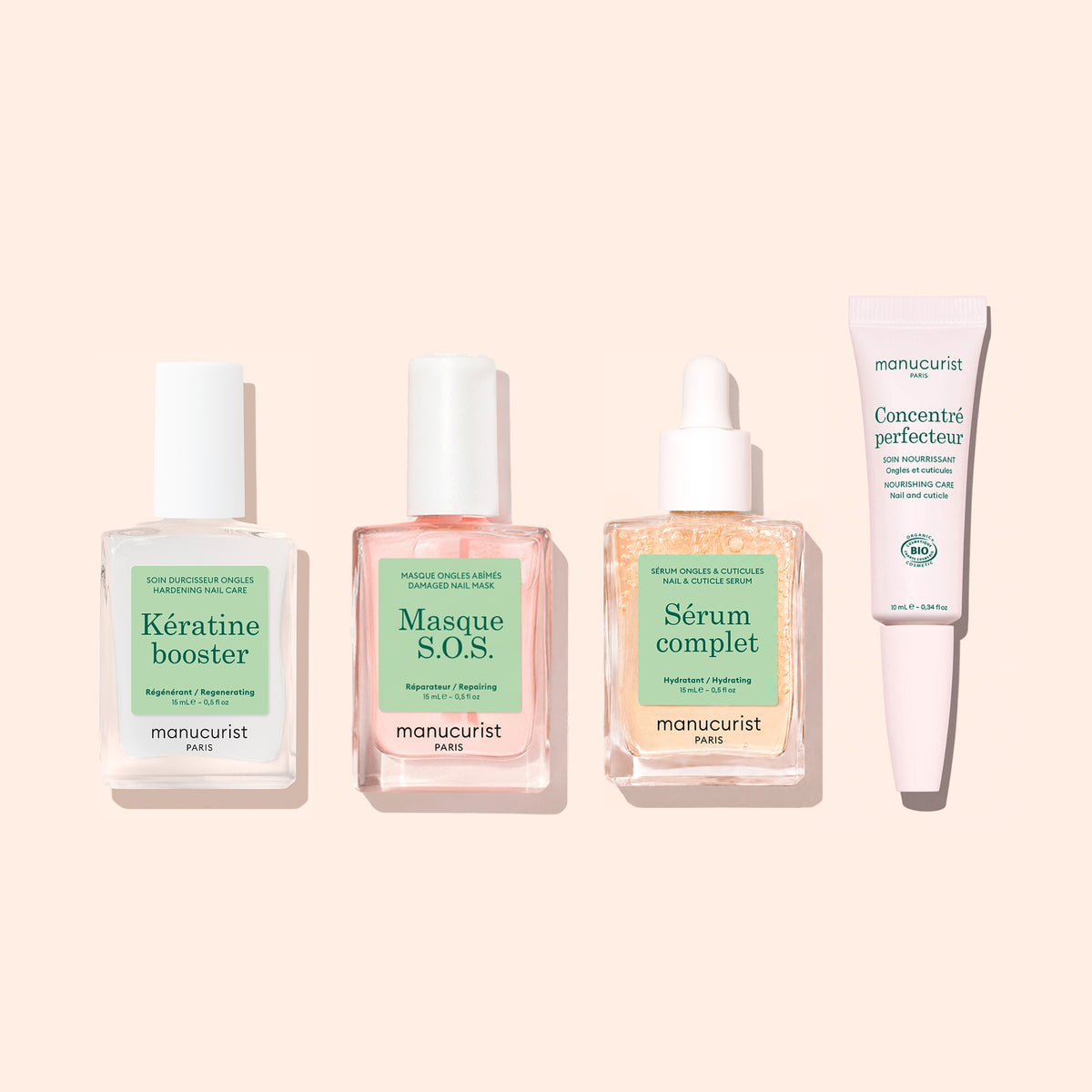 Two Manucurist Day Night Duo products are arranged side by side on a light beige background, each in different bottles and packaging.