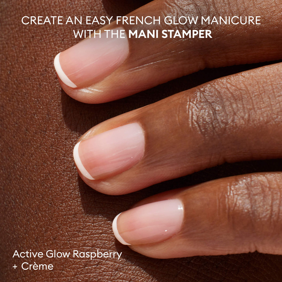 A hand with medium-dark skin shows neat French tips in Active Glow Raspberry + Crème, made using the French Active™ Kit and Mani Stamper tool. Text highlights nail kit essentials for a flawless manicure look.