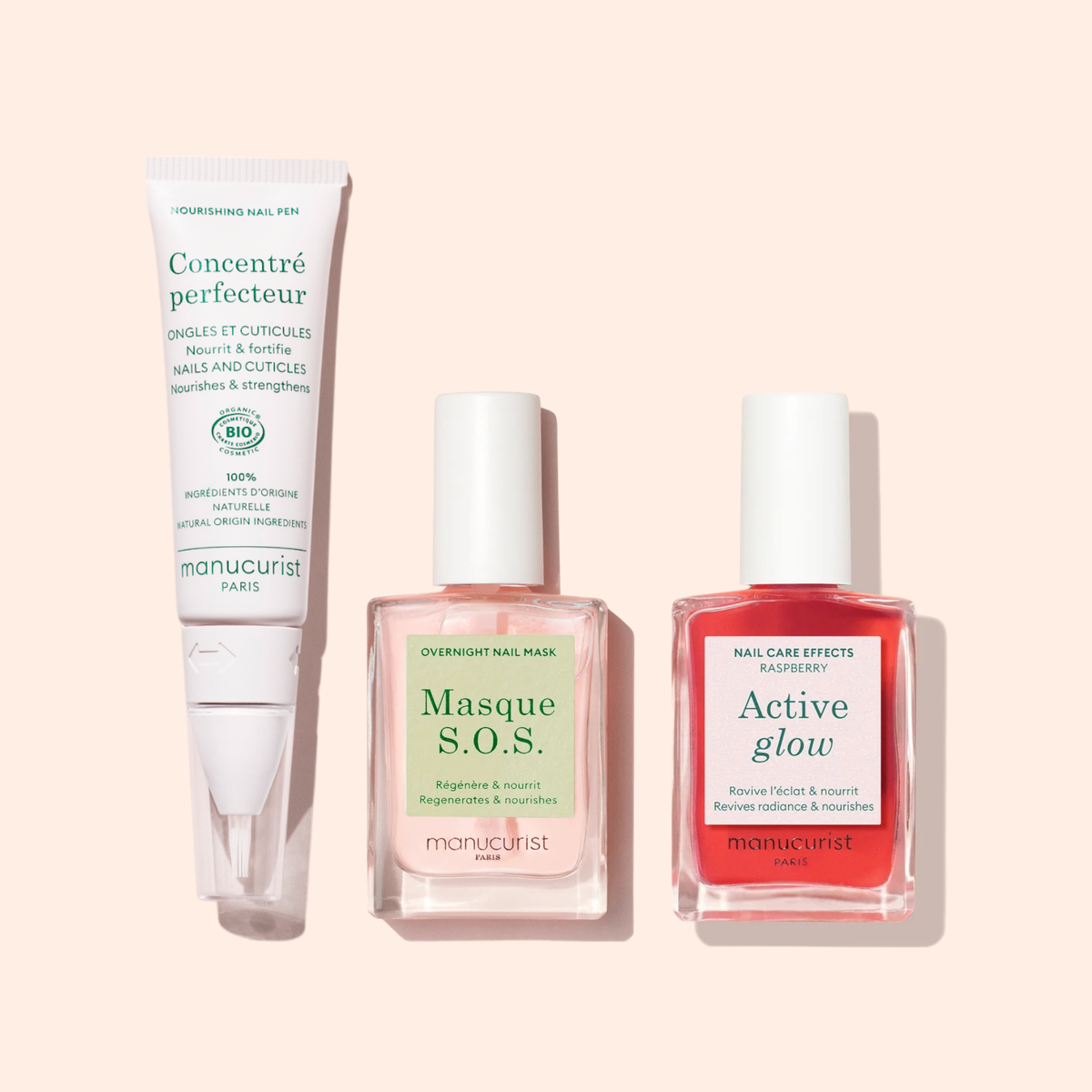 The Nourishing Nail Pen - Cosmos Organic by Manucurist, designed for nail strengthening and cuticle care, is shown on a pale pink background.