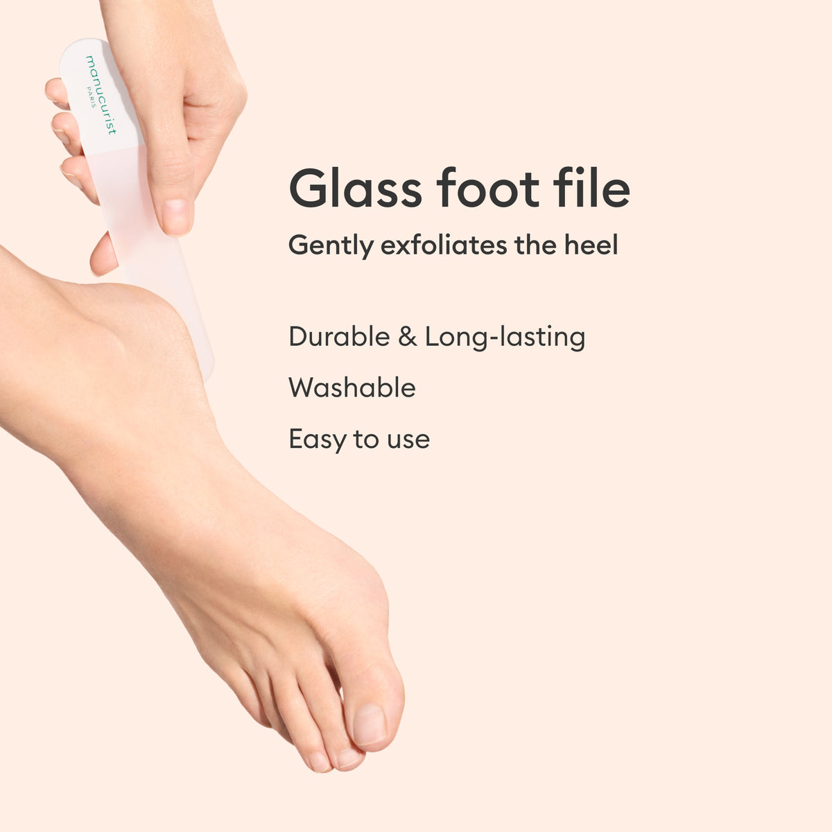 A person uses the Manucurist Glass Foot File on their heel against a beige background. Text beside the image reads: Manucurist Glass Foot File. Exfoliate for soft, smooth skin. Durable, washable, and easy to use.