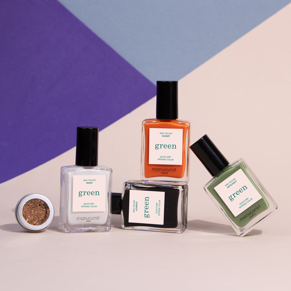 Manucurist’s Pumpkin Patch set includes white, orange, clear, and green gel polishes plus glitter—creating a vibrant nail art look on a pastel geometric background, perfect for your next Halloween manicure.