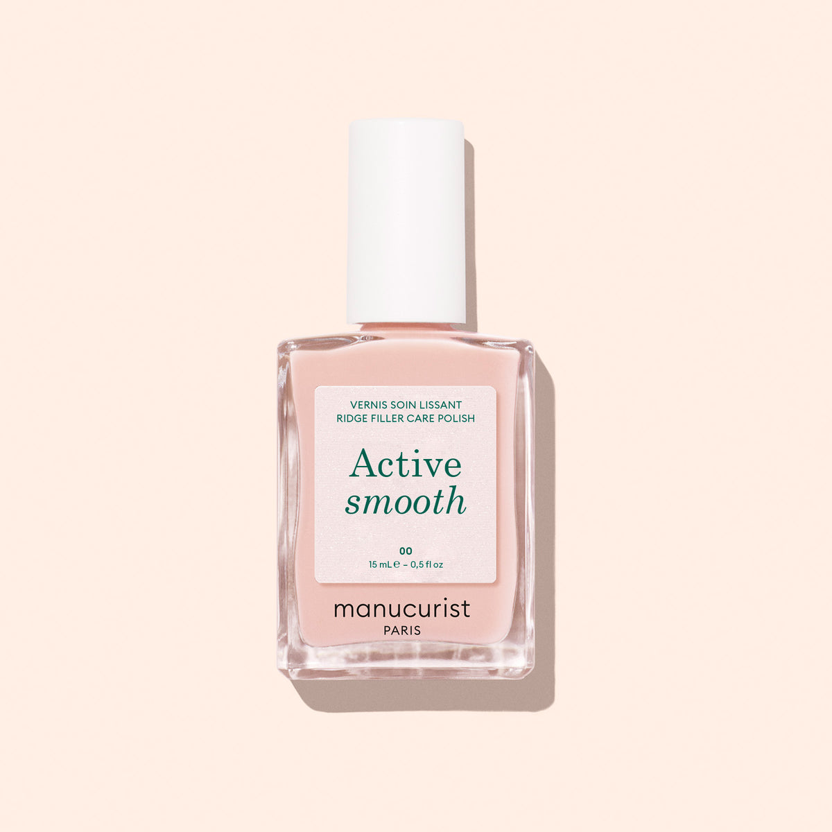 A bottle of Manucurist Active™ Smooth 00 nail care polish with a white cap is displayed against a light pink background—this CC Polish Treatment is the ultimate perfector for beautifully smooth, healthy-looking nails.