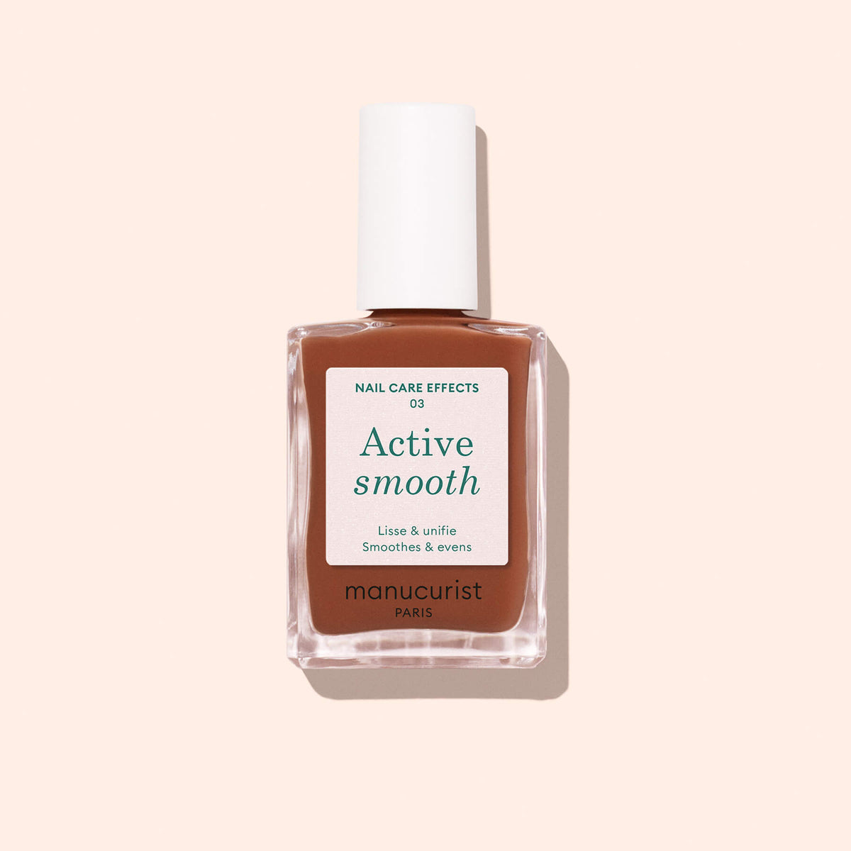 A bottle of Manucurist Active™ Smooth 03 nail treatment, featuring brown liquid, a white label, and a white cap, is photographed against a light beige background with a soft shadow—perfect for elevating your nail care routine. This CC Polish Treatment delivers a subtle Bronze Satin Finish for effortlessly polished nails.