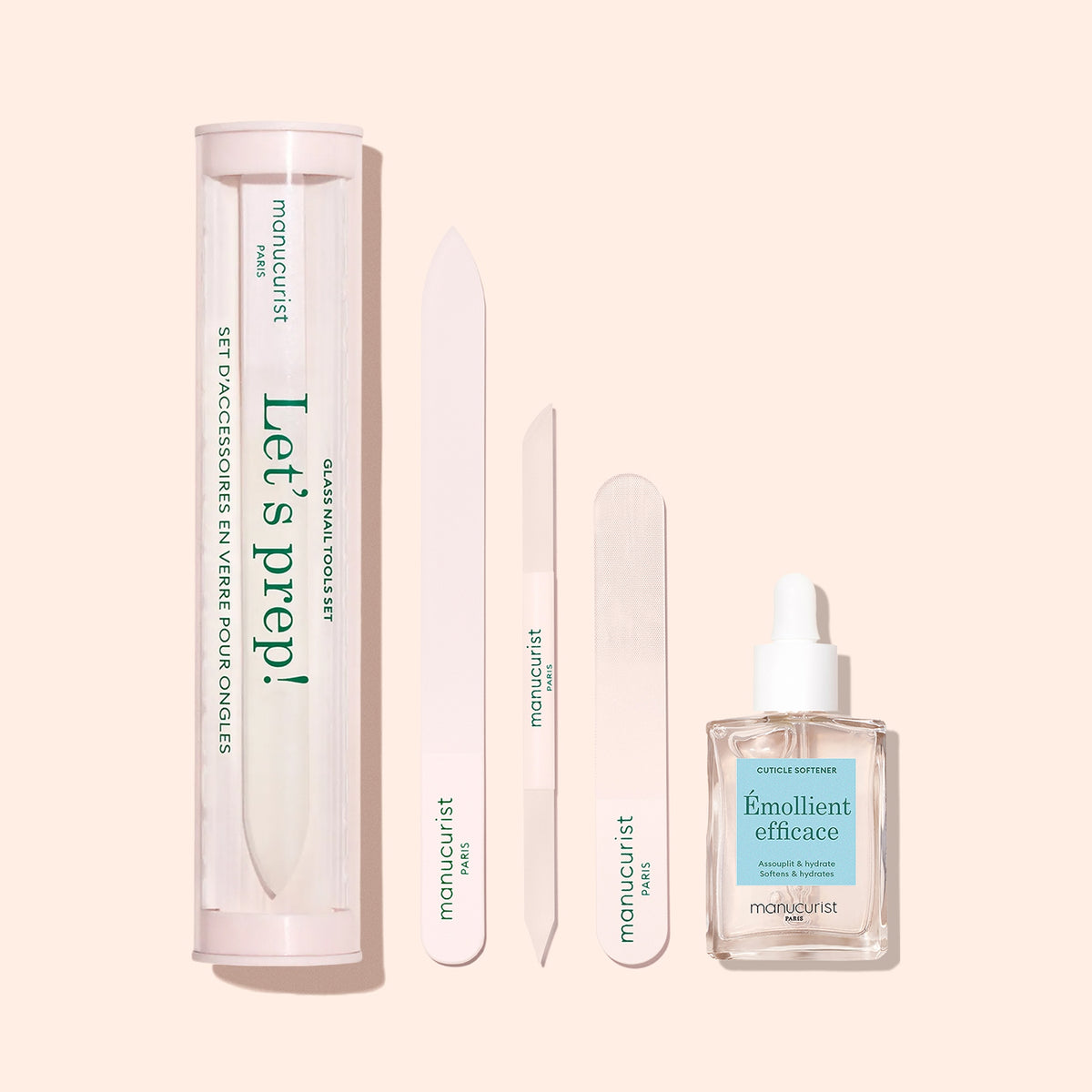 The Manucurist Glass Nail File set includes a premium glass file, buffer, emollient in a dropper bottle, and a “Let’s prep!” case—arranged neatly on a light beige background.