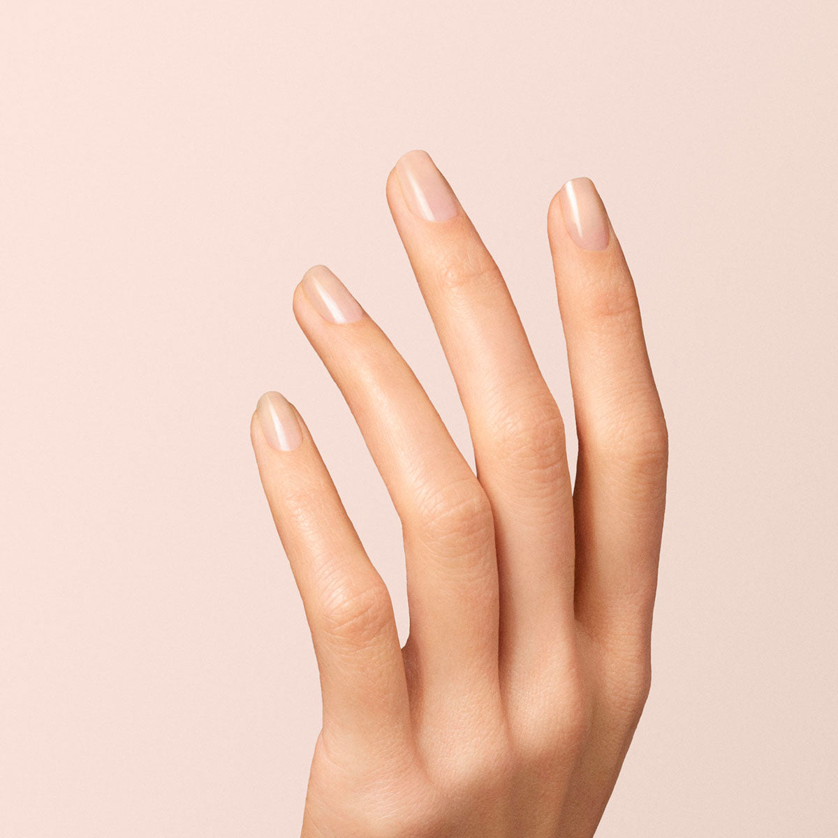 A close-up of a hand with clean, manicured nails coated in Manucurist&