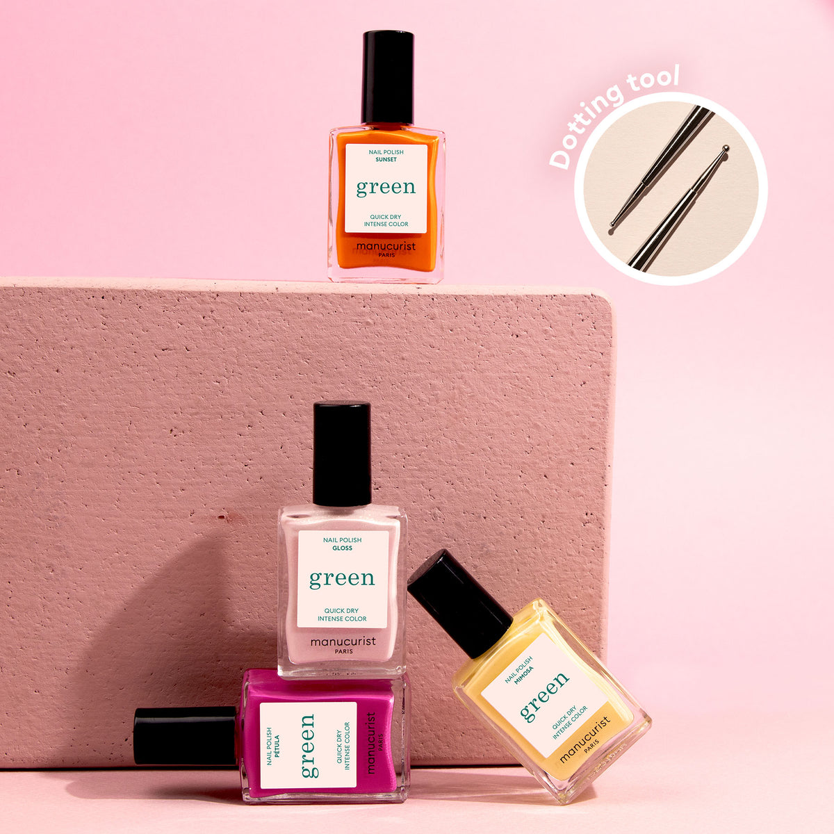 Four bottles of Manucurist Flower love polish in orange, white, pink, and yellow are arranged on a textured pink block, with a close-up of a Dotting Tool—perfect for springtime nail art—in the top right corner.