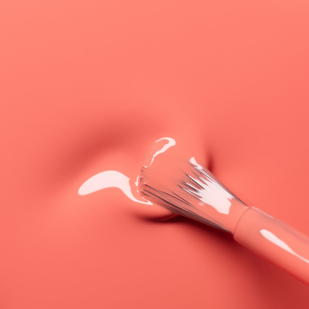 A paintbrush with pink bristles spreads glossy, shimmering pink paint over the smooth, coral orange Bird of Paradise gel polish surface by Manucurist, leaving a slight indentation where the brush meets the polish.