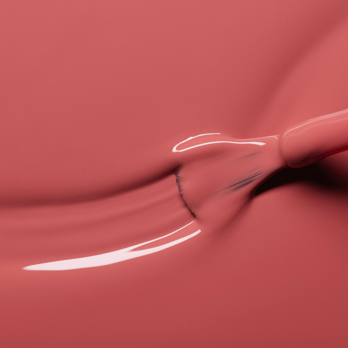 A close-up of a brush gliding through Manucurist&