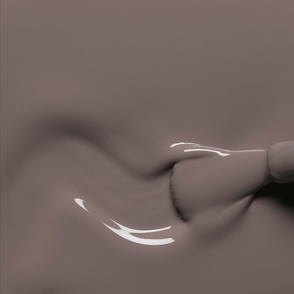 A close-up of a brush applying Manucurist&