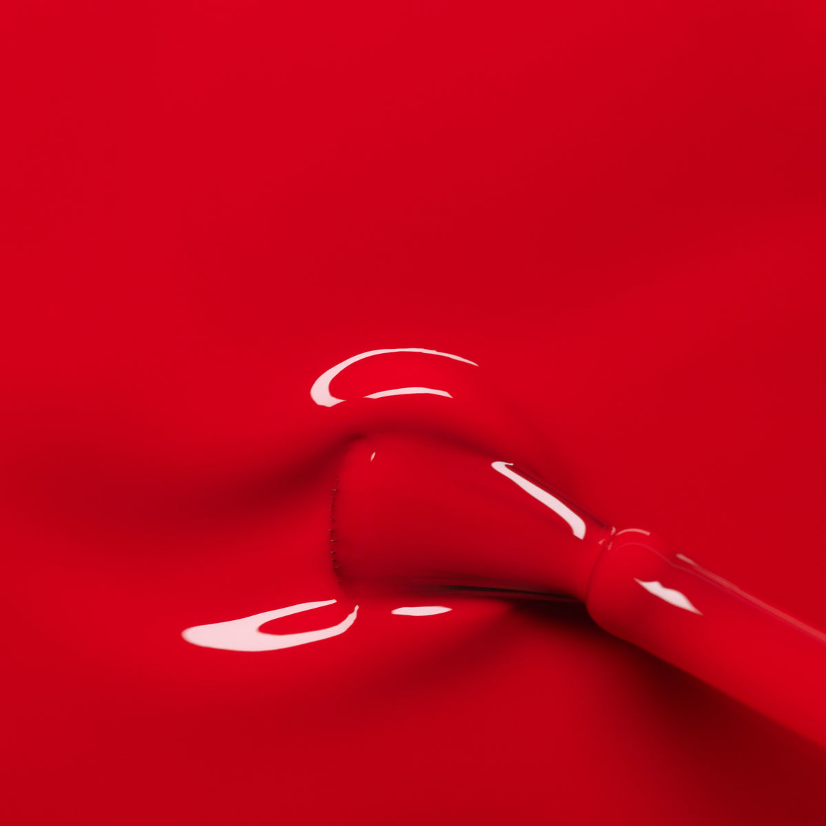A close-up of a brush spreading Manucurist-test&