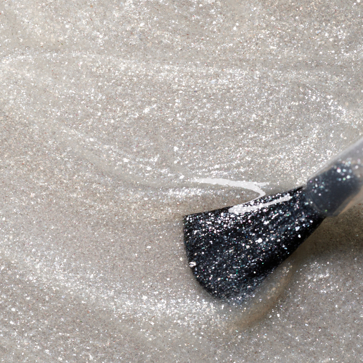 A close-up of a brush applying Manucurist&