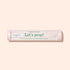 A clear cylindrical container labeled "Glass nail accessory trio" by Manucurist, designed to hold glass nail tools, is displayed against a light beige background.