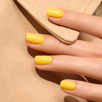 A close-up of a hand with neatly manicured nails painted in Manucurist&