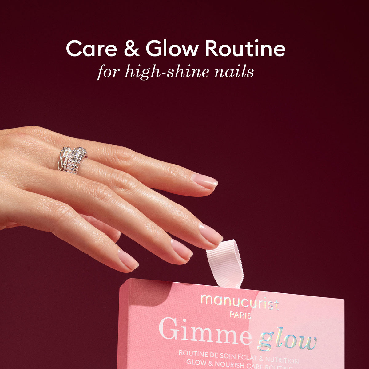 A manicured hand with a ring holds a pink box labeled Manucurist 5min&