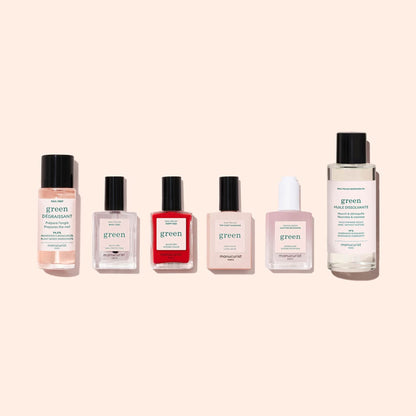 Six bottles from the Manucurist Discovery Kit, featuring plant-based nail polish and care products, including remover, gel effect shades, and nail oil, arranged in a row on a light beige background.