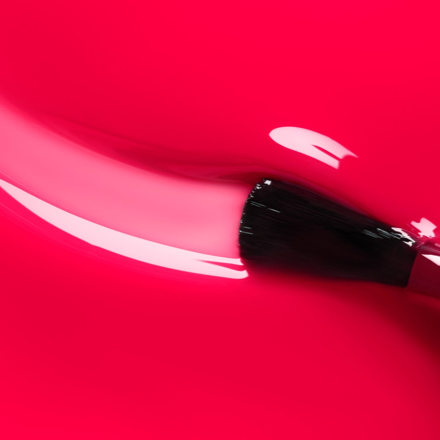 A close-up of a makeup brush gliding Manucurist&