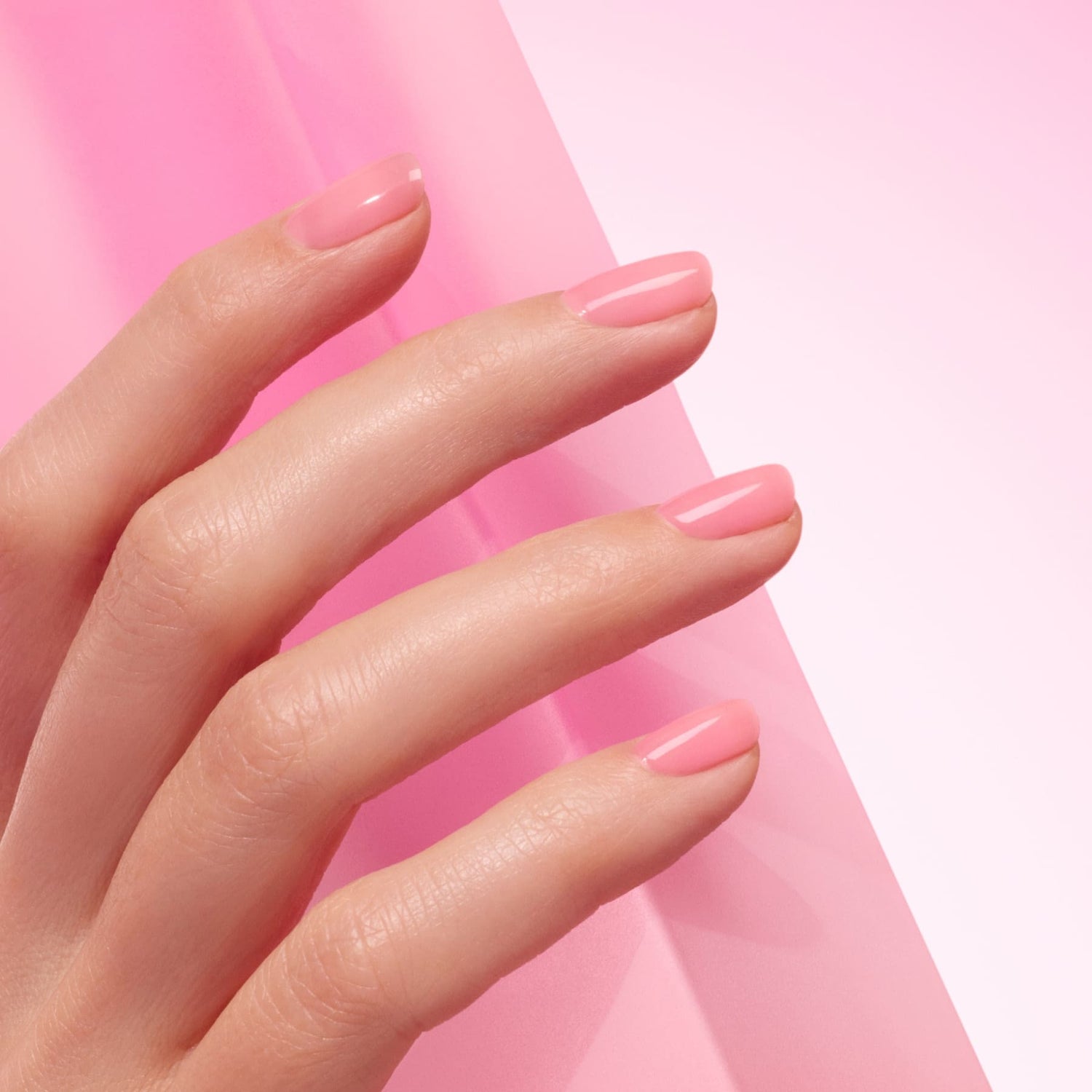 A close-up of a hand with neatly manicured nails painted in Manucurist&