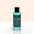 A bottle of Manucurist Customisable Trio Green Flash, featuring teal liquid, is displayed against a light pink and white background.