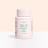 A light pink Manucurist Magic Dip Remover bottle stands against a light peach and white background. The label features product details and icons, emphasizing this acetone-free, travel-friendly express nail polish remover pot.